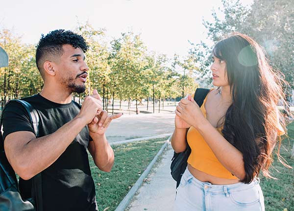 Deaf students talking to each other with sign language