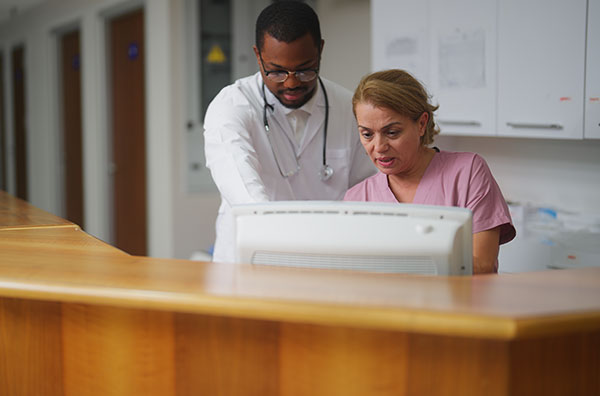 doctor and administrator talking at reception