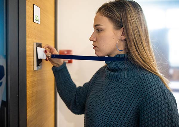 Female student using student id card