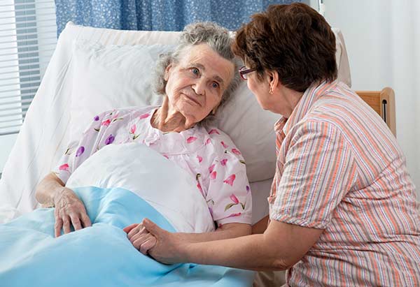 daughter visiting mother in hospital