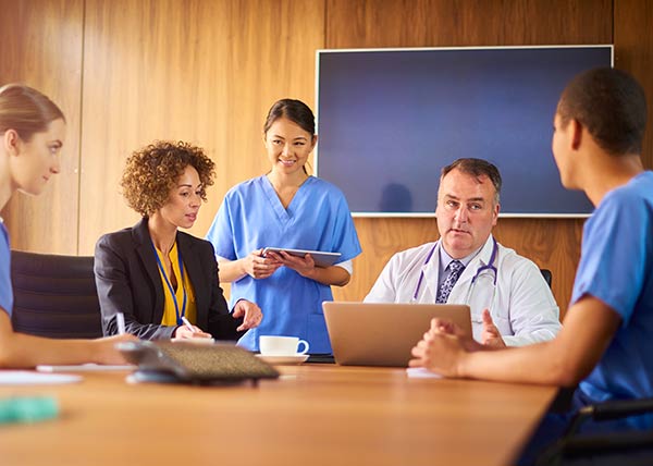 image of operations hospital staff meeting