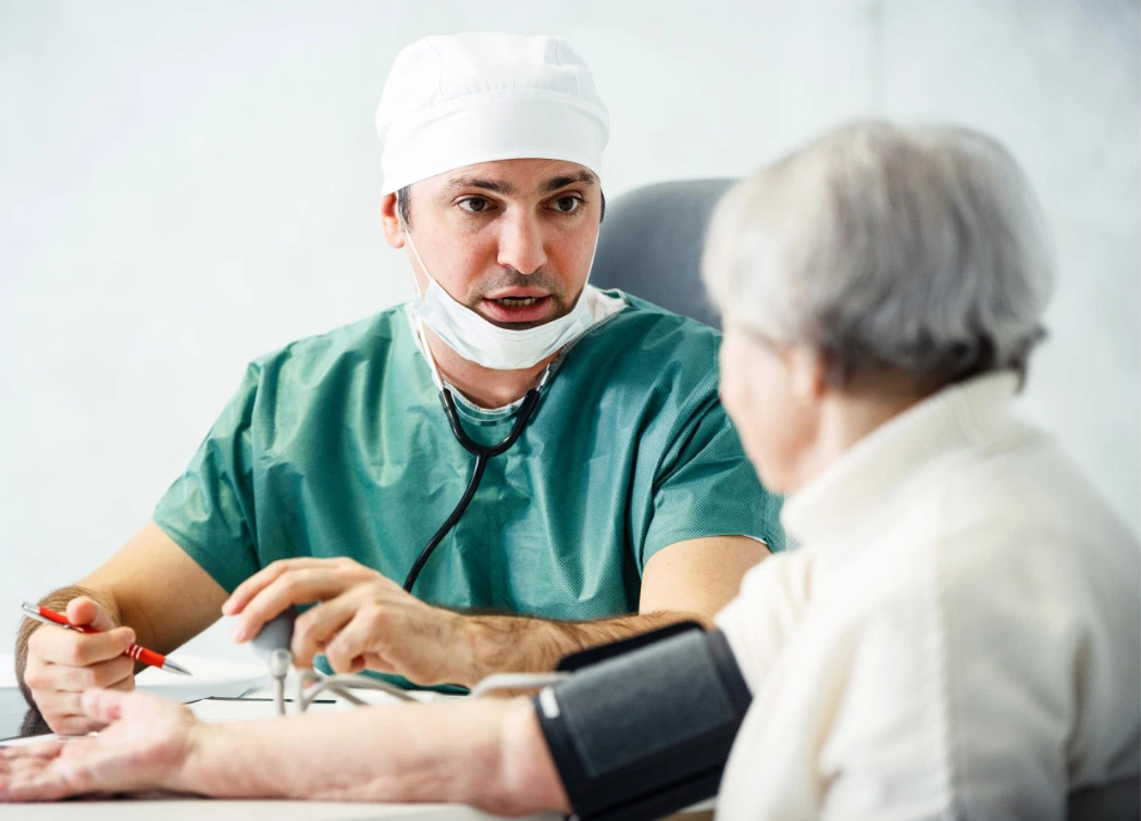 image of healthcare professional talking to elderly patient